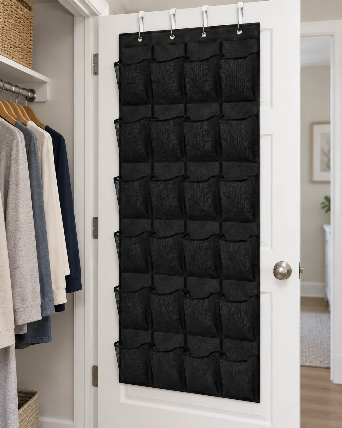 Black mesh organizer installed flat on the back of a white closet door