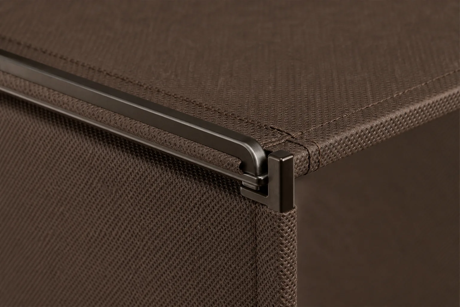 Close-up of the brown fabric deck and bronze steel frame construction