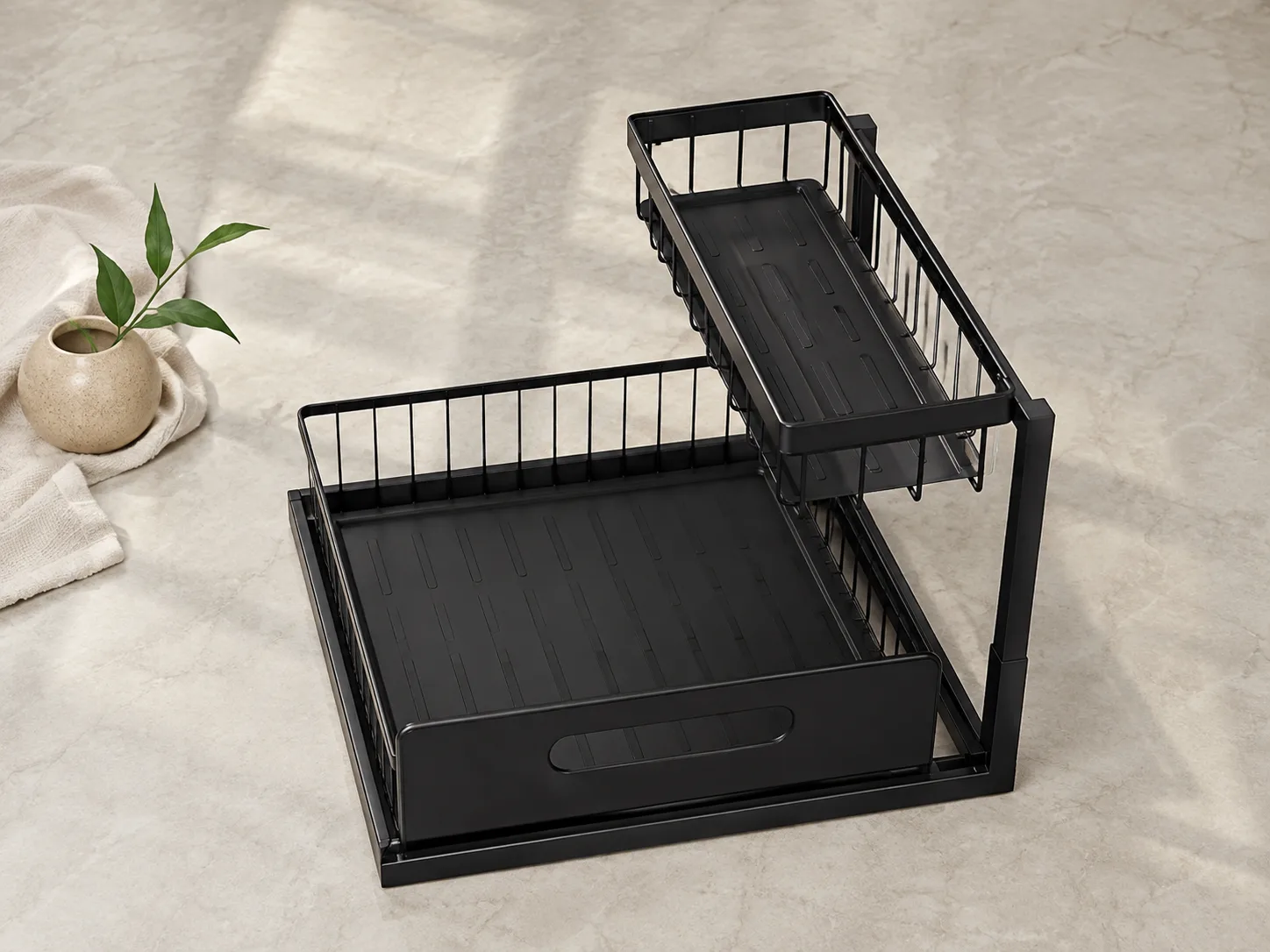 Overhead footprint of the L-shaped organizer with tape measure around plumbing cutout