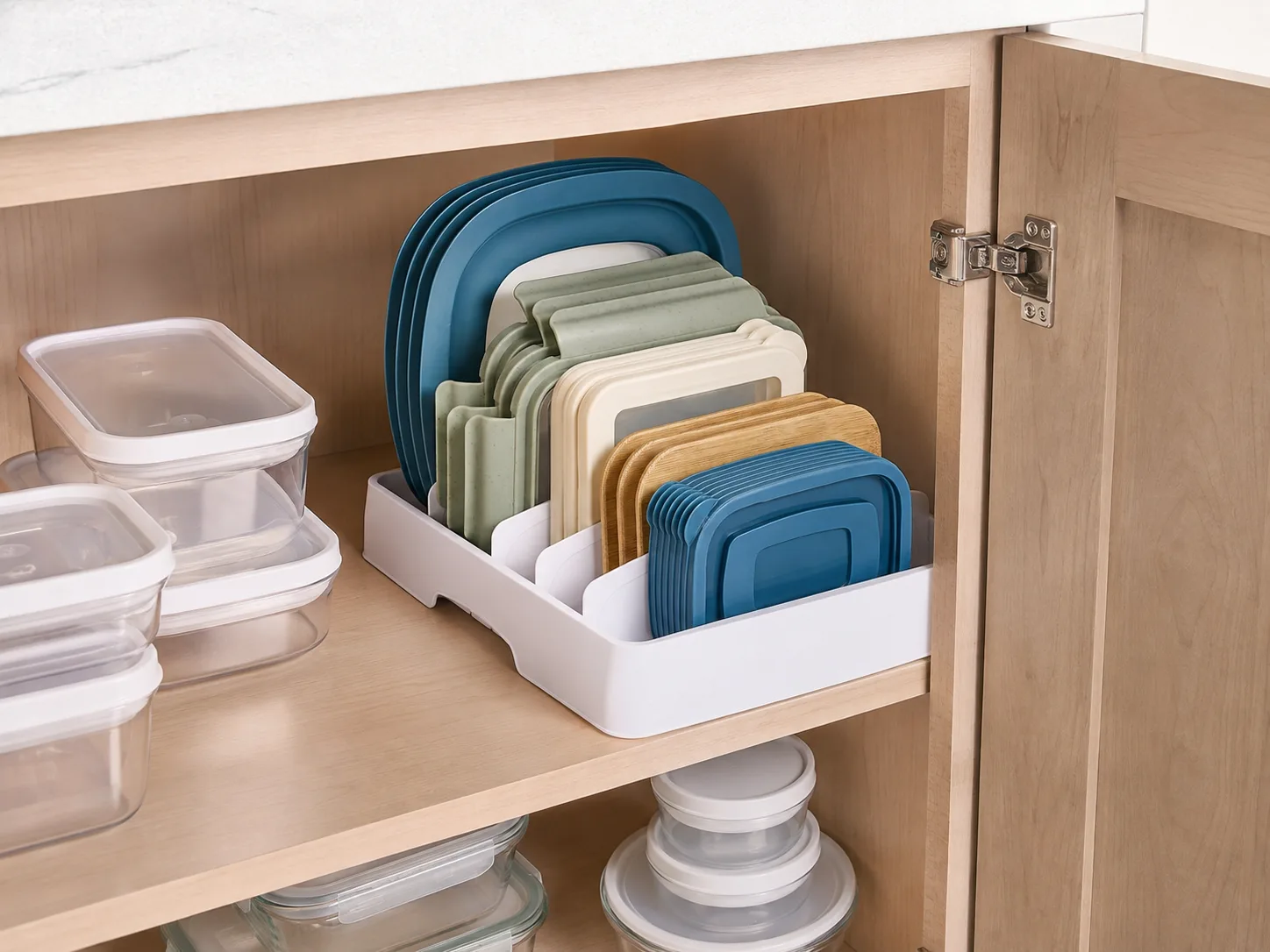Lids organized upright in a kitchen cabinet